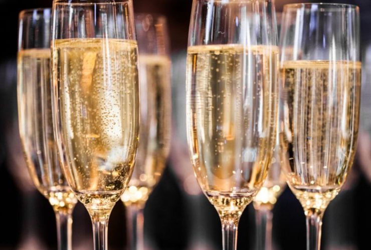 Glasses of sparkling wine lined up for a Napa bachelorette toast